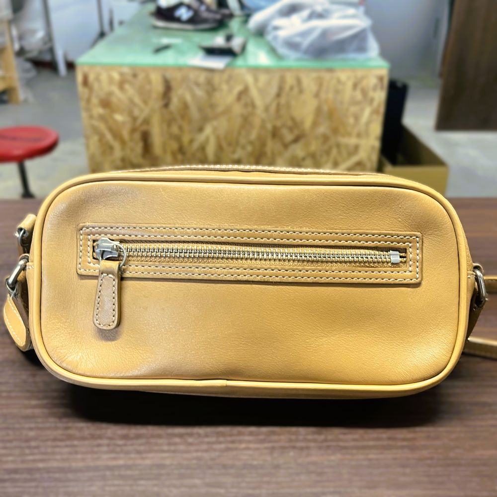COACHバッグの切れたパイピングを本革と新しい芯材で交換修理